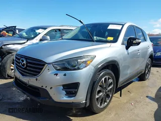 2016 Mazda CX-5 Grand Touring with VIN JM3KE4DY9G0795360, listed as a IAAI auction lot 41933991 with 176,373 mi miles. Bid and sale history available at carsss.com. Image 2.