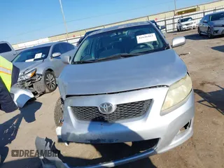 2009 Toyota Corolla with VIN JTDBL40E999021621, listed as a IAAI auction lot 41636462 with 123,650 mi miles. Bid and sale history available at carsss.com. Image 12.