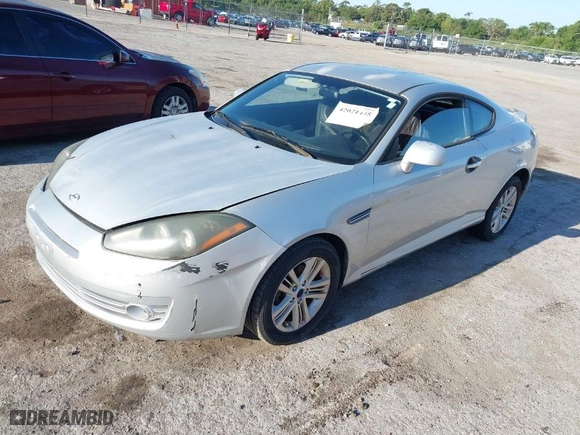 2008 Hyundai Tiburon GS with VIN KMHHM66D98U292591, listed as a IAAI auction lot 42021445 with 219,750 mi miles. Bid and sale history available at carsss.com. Image 2.