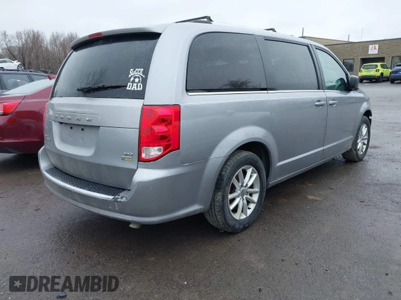 2019 Dodge Grand Caravan SXT with VIN 2C4RDGCG1KR580039, listed as a IAAI auction lot 41997472 with 163,915 mi miles and . Bid and sale history available at DreamBid. Image 4.