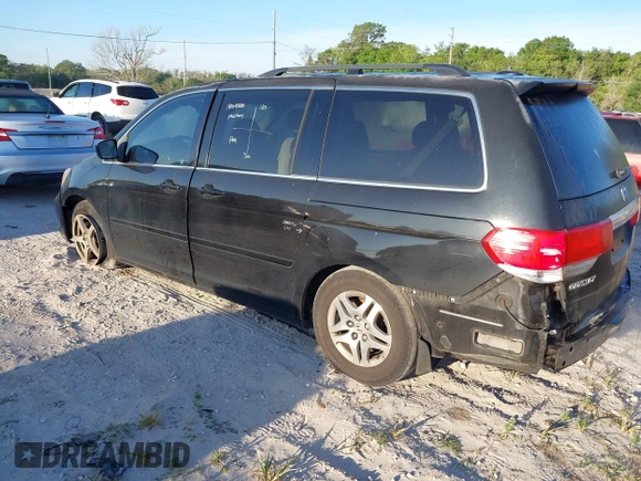 2010 Honda Odyssey Touring with VIN 5FNRL3H95AB031007, listed as a IAAI auction lot 41852435 with 207,919 mi miles. Bid and sale history available at carsss.com. Image 3.