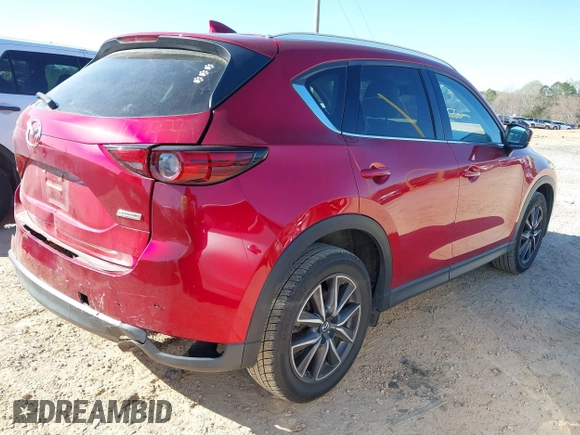 2018 Mazda CX-5 Grand Touring with VIN JM3KFADM3J0380826, listed as a IAAI auction lot 41888097 with 70,529 mi miles. Bid and sale history available at carsss.com. Image 4.