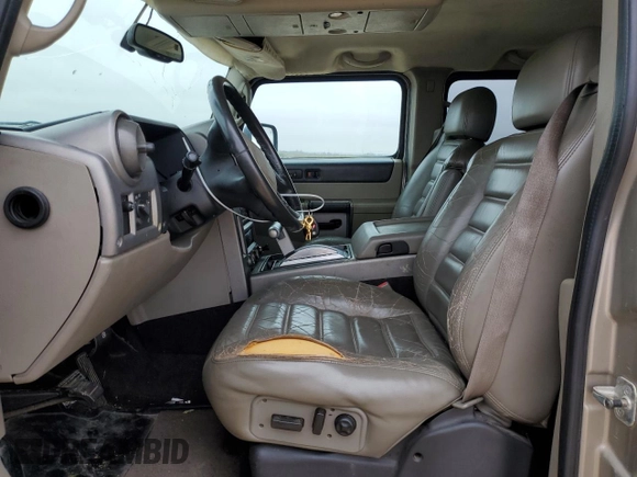 2003 Hummer H2 with VIN 5GRGN23U73H102412, listed as a Copart auction lot 87419024 with 176,456 mi miles and Salvage Title. Bid and sale history available at carsss.com. Image 7.