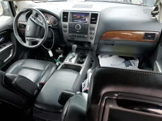 2015 Nissan Armada Platinum z VIN 5N1BA0NF6FN617932, wystawiony jako Copart lot #48202355 z przebiegiem 101 219 mil mil oraz Szkoda całkowita • Salvage title. Historia ofert i sprzedaży dostępna na DreamBid. Obrazek 8.