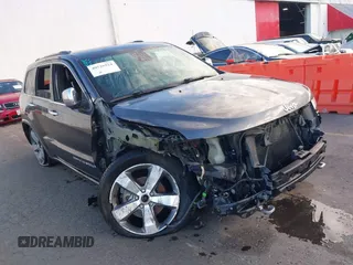 2015 Jeep Grand Cherokee Overland with VIN 1C4RJFCG3FC697994, listed as a IAAI auction lot 40526924 with 199,275 mi miles and . Bid and sale history available at DreamBid. Image 1.