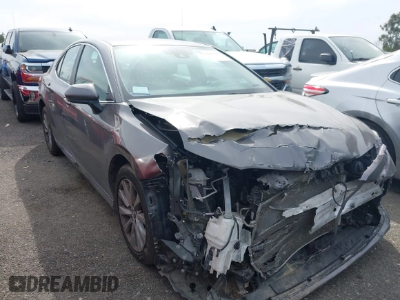 2019 Toyota Camry LE with VIN 4T1B11HK4KU254853, listed as a IAAI auction lot 42013255 with 153,664 mi miles and . Bid and sale history available at DreamBid. Image 1.
