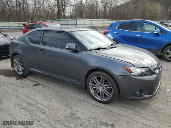 2011 Scion tC with VIN JTKJF5C71B3017022, listed as a Copart auction lot 52859865 with 220,603 mi miles and Salvage Title. Bid and sale history available at carsss.com. Image 4.