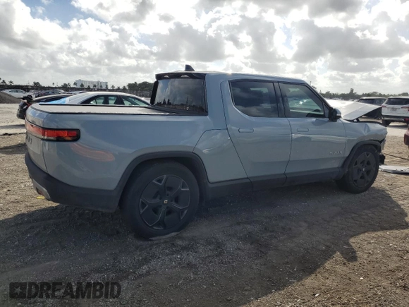2023 Rivian R1T Adventure with VIN 7FCTGBAA2PN028983, listed as a Copart auction lot 45307015 with 220 mi miles and Salvage Title. Bid and sale history available at DreamBid. Image 3.