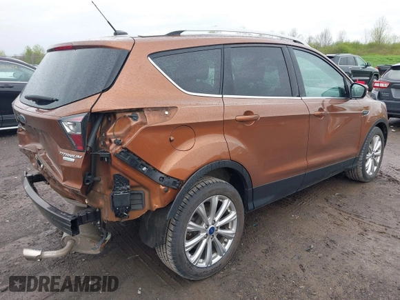 2017 Ford Escape Titanium with VIN 1FMCU0JD3HUB20846, listed as a IAAI auction lot 42182260 with 28,610 mi miles and . Bid and sale history available at DreamBid. Image 4.