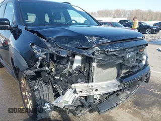 2022 Honda Passport TrailSport z VIN 5FNYF8H63NB015562, wystawiony jako IAAI lot #41914797 z przebiegiem 58 084 mil mil oraz . Historia ofert i sprzedaży dostępna na DreamBid. Obrazek 6.