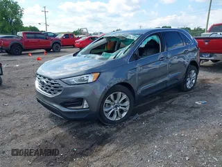 2021 Ford Edge Titanium z VIN 2FMPK3K9XMBA21766, wystawiony jako IAAI lot #42187940 z przebiegiem 79 732 mil mil oraz . Historia ofert i sprzedaży dostępna na DreamBid. Obrazek 19.
