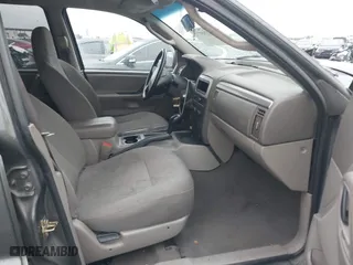 2004 Jeep Grand Cherokee Laredo with VIN 1J4GX48S14C177923, listed as a IAAI auction lot 41745772 with 242,506 mi miles. Bid and sale history available at carsss.com. Image 5.