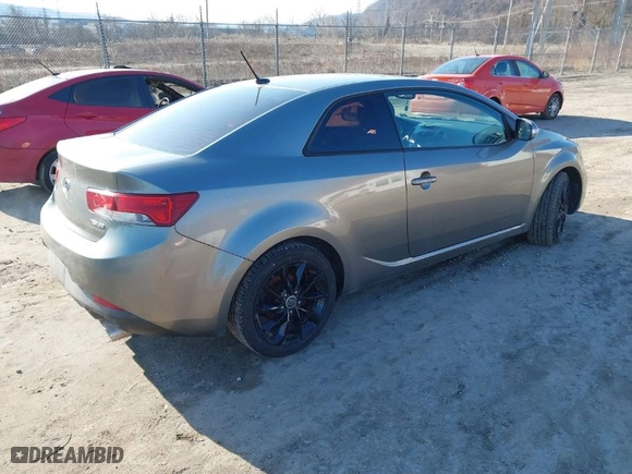 2010 Kia Forte Koup SX with VIN KNAFW6A38A5267375, listed as a IAAI auction lot 41699378 with 174,880 mi miles. Bid and sale history available at carsss.com. Image 4.
