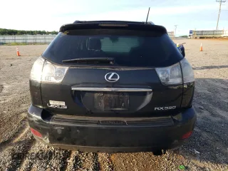 2006 Lexus RX 330 with VIN 2T2HA31U26C096680, listed as a Copart auction lot 57435695 with 228,457 mi miles and Salvage title. Bid and sale history available at DreamBid. Image 6.