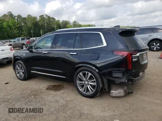 2020 Cadillac XT6 FWD Premium Luxury with VIN 1GYKPCRS6LZ102682, listed as a Copart auction lot 56906645 with 76,884 mi miles and Salvage title. Bid and sale history available at DreamBid. Image 2.