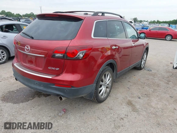 2015 Mazda CX-9 Grand Touring with VIN JM3TB2DA6F0460785, listed as a IAAI auction lot 42474705 with 62,202 mi miles and . Bid and sale history available at DreamBid. Image 4.