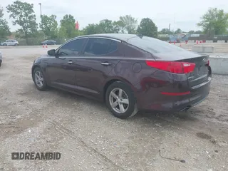 2014 Kia Optima LX z VIN 5XXGM4A7XEG305629, wystawiony jako IAAI lot #42370105 z przebiegiem 240 254 mil mil oraz . Historia ofert i sprzedaży dostępna na DreamBid. Obrazek 3.