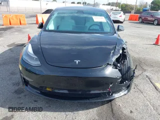 2022 Tesla Model 3 Long Range with VIN 5YJ3E1EB6NF233131, listed as a IAAI auction lot 41819409 with 38,308 mi miles and . Bid and sale history available at DreamBid. Image 11.