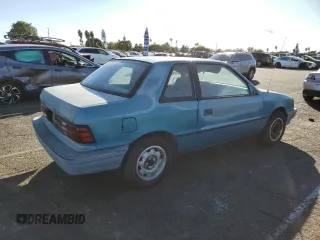 1991 Plymouth Sundance z VIN 1P3XP24D6MN564571, wystawiony jako Copart lot #78415044 z przebiegiem 50 625 mil mil oraz Tytuł czysty. Historia ofert i sprzedaży dostępna na DreamBid. Obrazek 3.