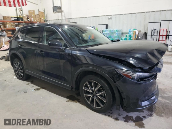 2018 Mazda CX-5 Grand Touring with VIN JM3KFADM3J0325843, listed as a Copart auction lot 87958375 with 93,577 mi miles and Salvage title. Bid and sale history available at DreamBid. Image 4.