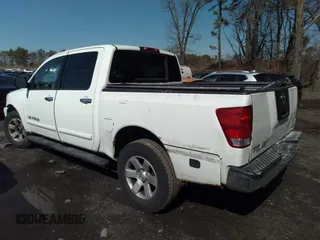 2005 Nissan Titan SE with VIN 1N6AA07B25N514643, listed as a IAAI auction lot 32638857 with 214,304 mi miles. Bid and sale history available at carsss.com. Image 3.