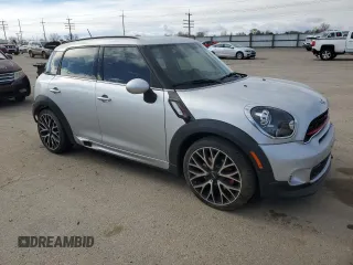 2016 MINI Countryman John Cooper Works with VIN WMWXD1C52GWT97652, listed as a Copart auction lot 49282345 with 51,983 mi miles and Salvage Title. Bid and sale history available at DreamBid. Image 4.
