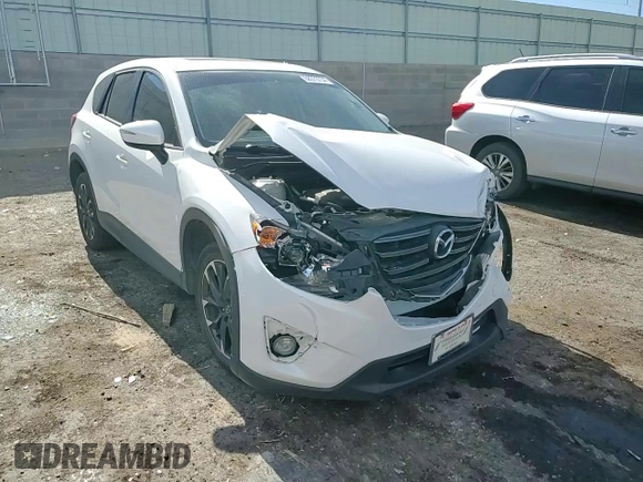 2016 Mazda CX-5 Grand Touring with VIN JM3KE2DY0G0888854, listed as a Copart auction lot 68379754 with 73,096 mi miles and Salvage Title. Bid and sale history available at carsss.com. Image 12.