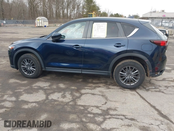 2021 Mazda CX-5 Touring with VIN JM3KFBCM7M1380396, listed as a IAAI auction lot 41707612 with 55,555 mi miles. Bid and sale history available at carsss.com. Image 14.