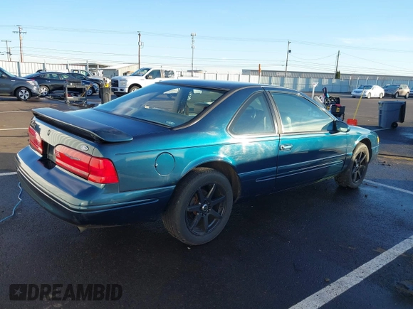 1996 Ford Thunderbird LX z VIN 1FALP62W1TH100925, wystawiony jako IAAI lot #41289811 z przebiegiem 84 056 mil mil oraz . Historia ofert i sprzedaży dostępna na DreamBid. Obrazek 4.