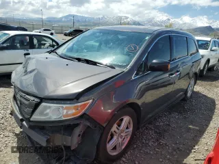 2012 Honda Odyssey Touring with VIN 5FNRL5H97CB070213, listed as a Copart auction lot 53558715 with 218,964 mi miles and Salvage title. Bid and sale history available at DreamBid. Image 1.