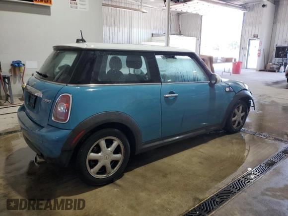 2009 MINI Hardtop with VIN WMWMF33569TW74610, listed as a Copart auction lot 54889805 with 147,533 mi miles and Salvage Title. Bid and sale history available at DreamBid. Image 3.
