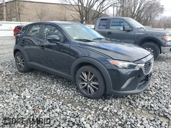2017 Mazda CX-3 Touring with VIN JM1DKFC70H0141685, listed as a Copart auction lot 49791715 with 127,416 mi miles and Salvage Title. Bid and sale history available at DreamBid. Image 4.