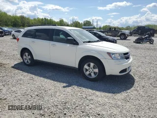 2013 Dodge Journey SE with VIN 3C4PDCAB3DT699816, listed as a Copart auction lot 52856455 with 67,688 mi miles and Salvage Title. Bid and sale history available at carsss.com. Image 4.