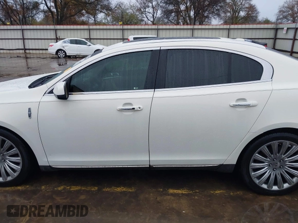 2013 Lincoln MKS with VIN 1LNHL9DK4DG605058, listed as a IAAI auction lot 41068489 with 101,801 mi miles. Bid and sale history available at carsss.com. Image 15.