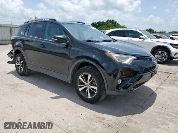 2018 Toyota RAV4 XLE with VIN 2T3WFREV2JW433186, listed as a Copart auction lot 61008705 with 57,310 mi miles and Salvage title. Bid and sale history available at DreamBid. Image 4.