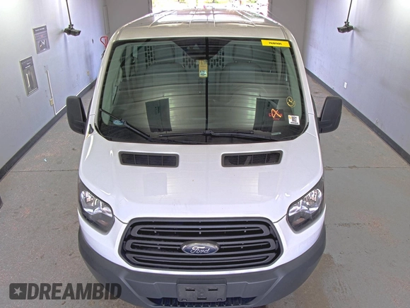 2018 Ford Transit z VIN 1FTYE1YM0JKB52111, wystawiony jako IAAI lot #42789026 z przebiegiem 132 936 mil mil oraz . Historia ofert i sprzedaży dostępna na DreamBid. Obrazek 37.