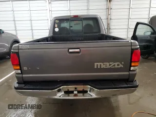 2000 Mazda B-Series 2WD Truck SE with VIN 4F4YR16V8YTM12086, listed as a Copart auction lot 82609244 with 297,354 mi miles and Salvage Title. Bid and sale history available at carsss.com. Image 6.