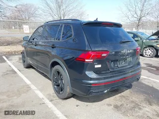 2023 Volkswagen Tiguan SE R-Line Black with VIN 3VVCB7AXXPM094621, listed as a IAAI auction lot 41737103 with 21,069 mi miles. Bid and sale history available at carsss.com. Image 3.