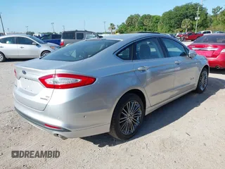 2013 Ford Fusion SE Hybrid with VIN 3FA6P0LU6DR127108, listed as a IAAI auction lot 42023529 with 250,057 mi miles. Bid and sale history available at carsss.com. Image 4.