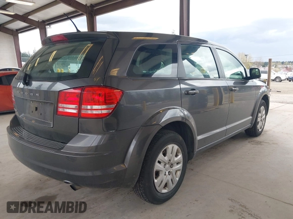 2015 Dodge Journey SE z VIN 3C4PDCAB1FT617794, wystawiony jako IAAI lot #41922371 z przebiegiem 130 558 mil mil oraz . Historia ofert i sprzedaży dostępna na DreamBid. Obrazek 4.