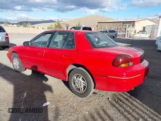 1996 Pontiac Grand Am SE with VIN 1G2NE52T7TC851196, listed as a IAAI auction lot 41700021 with 250,393 mi miles. Bid and sale history available at carsss.com. Image 3.