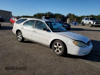 2002 Ford Taurus SE Standard with VIN 1FAFP58U52A144446, listed as a Copart auction lot 42825114 with 182,653 mi miles and Salvage title. Bid and sale history available at DreamBid. Image 4.