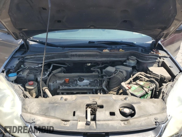 2010 Honda CR-V LX z VIN 5J6RE3H38AL034061, wystawiony jako Copart lot #54978905 z przebiegiem 154 951 mil mil oraz Szkoda całkowita • Salvage title. Historia ofert i sprzedaży dostępna na DreamBid. Obrazek 11.