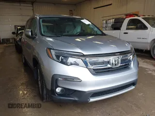 2020 Honda Pilot EX z VIN 5FNYF6H30LB060899, wystawiony jako IAAI lot #41439529 z przebiegiem 66 506 mil mil oraz . Historia ofert i sprzedaży dostępna na DreamBid. Obrazek 1.