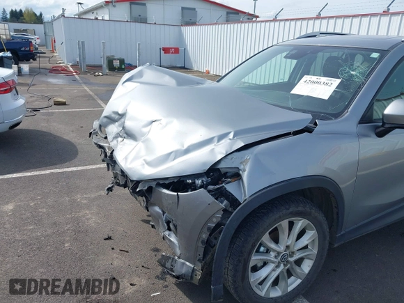 2014 Mazda CX-5 Grand Touring with VIN JM3KE4DY9E0375014, listed as a IAAI auction lot 42000382 with 110,584 mi miles and . Bid and sale history available at DreamBid. Image 18.