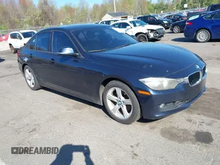 2013 BMW 3 Series 328i xDrive with VIN WBA3B3G54DNR80235, listed as a IAAI auction lot 42105883 with 144,023 mi miles. Bid and sale history available at carsss.com. Image 1.