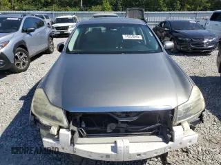 2010 Infiniti M with VIN JN1CY0AP5AM911259, listed as a Copart auction lot 74220044 with 265,925 mi miles and Salvage Title. Bid and sale history available at DreamBid. Image 5.