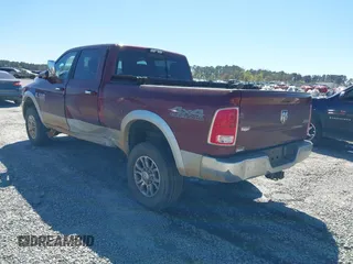 2017 Ram 2500 Laramie z VIN 3C6UR5FL6HG693953, wystawiony jako IAAI lot #41849571 z przebiegiem 99 754 mil mil oraz . Historia ofert i sprzedaży dostępna na DreamBid. Obrazek 3.