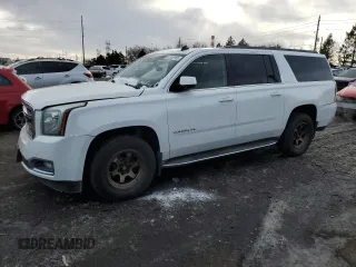 2015 GMC Yukon XL SLT with VIN 1GKS2HKC0FR220823, listed as a Copart auction lot 42155185 with 199,385 mi miles and Salvage Title. Bid and sale history available at carsss.com. Image 1.
