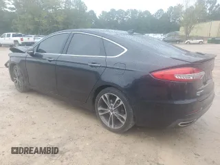 2019 Ford Fusion Titanium with VIN 3FA6P0K9XKR217324, listed as a Copart auction lot 56104185 with 135,728 mi miles and Salvage title. Bid and sale history available at DreamBid. Image 2.
